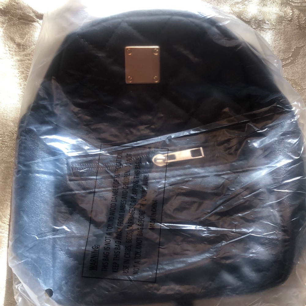 BNWT plushy quilted mini backpack